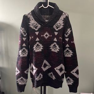 A large gray and burgundy sweater